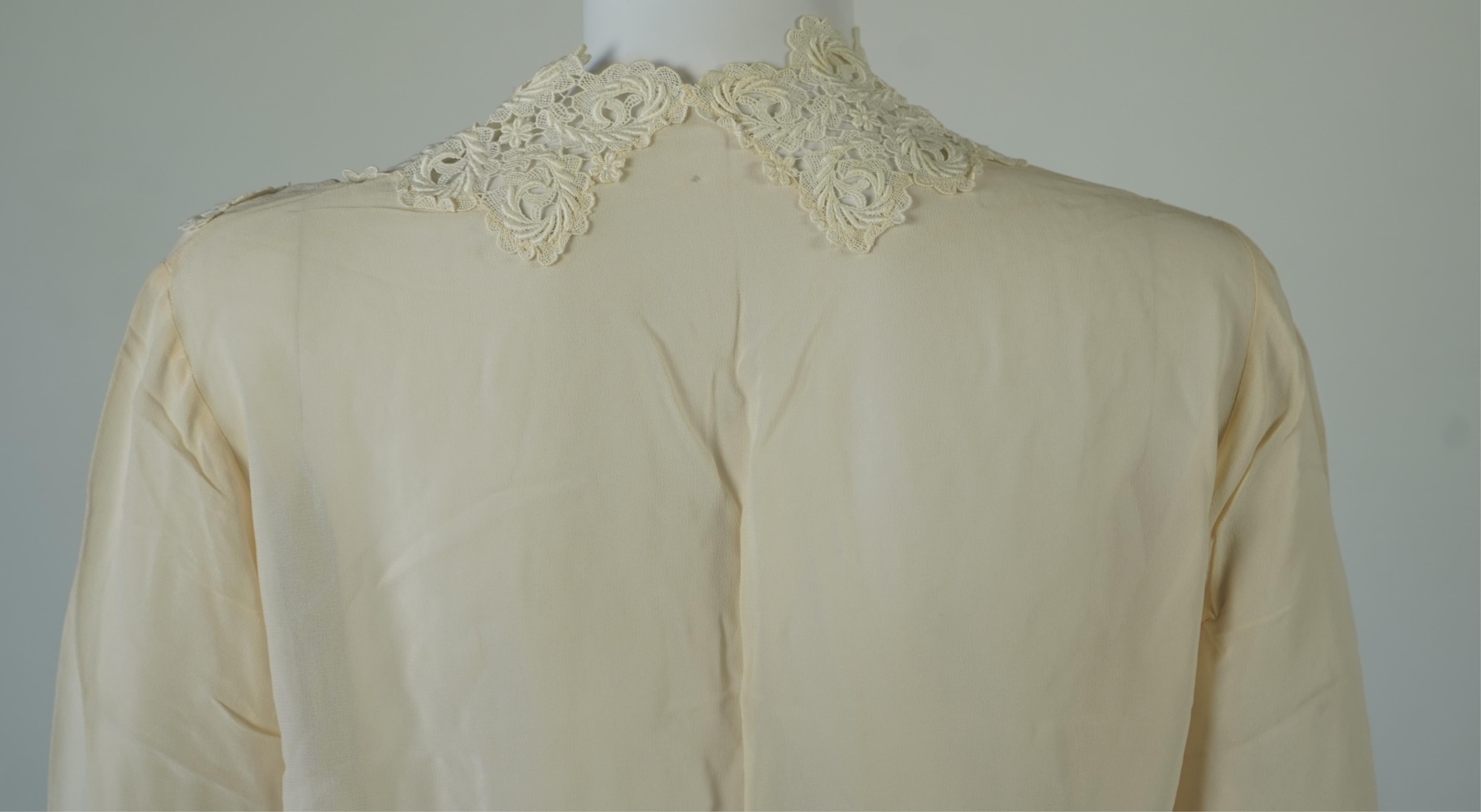 A 1940’s-50’s short sleeve lime green silk embroidered blouse, a pale pink silk crepe long sleeved blouse with white lace and a late 19th century navy silk chiffon blouse. Condition - the navy blouse is fragile but may b